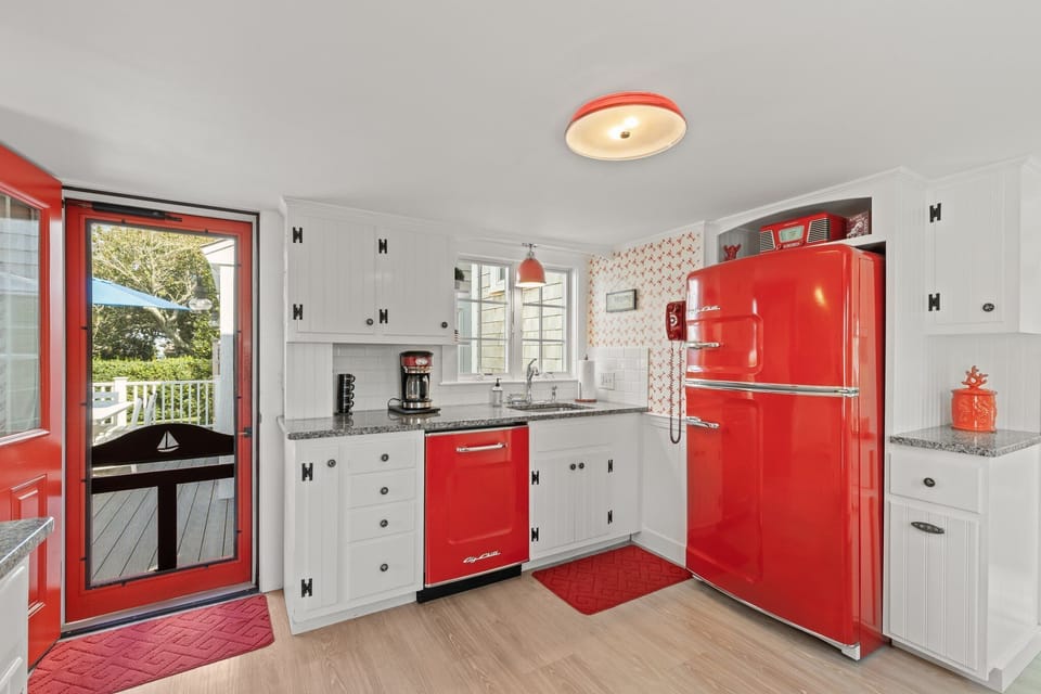 Rear deck opens up into the vintage style kitchen through the rear entry door