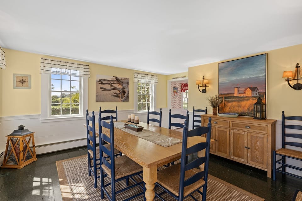 Large dining room table with seating for eight.