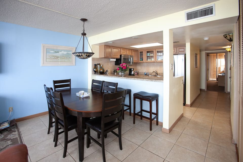 Dining and Kitchen arrangement, with table expanded for six.