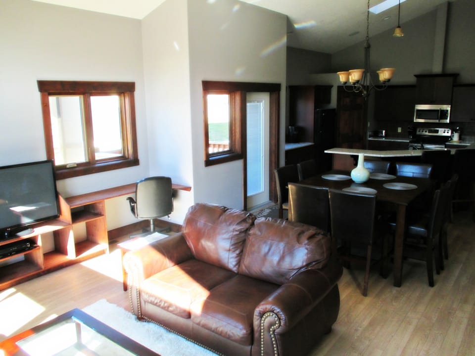 living room and dining room.  Dinning room with pub style table and 8 chairs