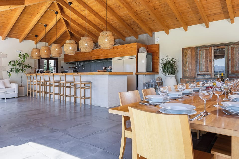 Adjacent to the kitchen, the spacious dining area comfortably seats up to 14 guests, setting the perfect stage for shared meals and lively conversations.