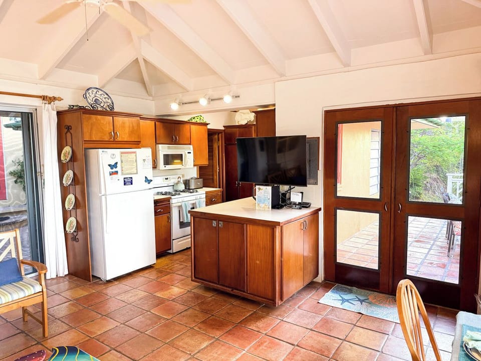 Looking towards the kitchen and entrance from the dining area