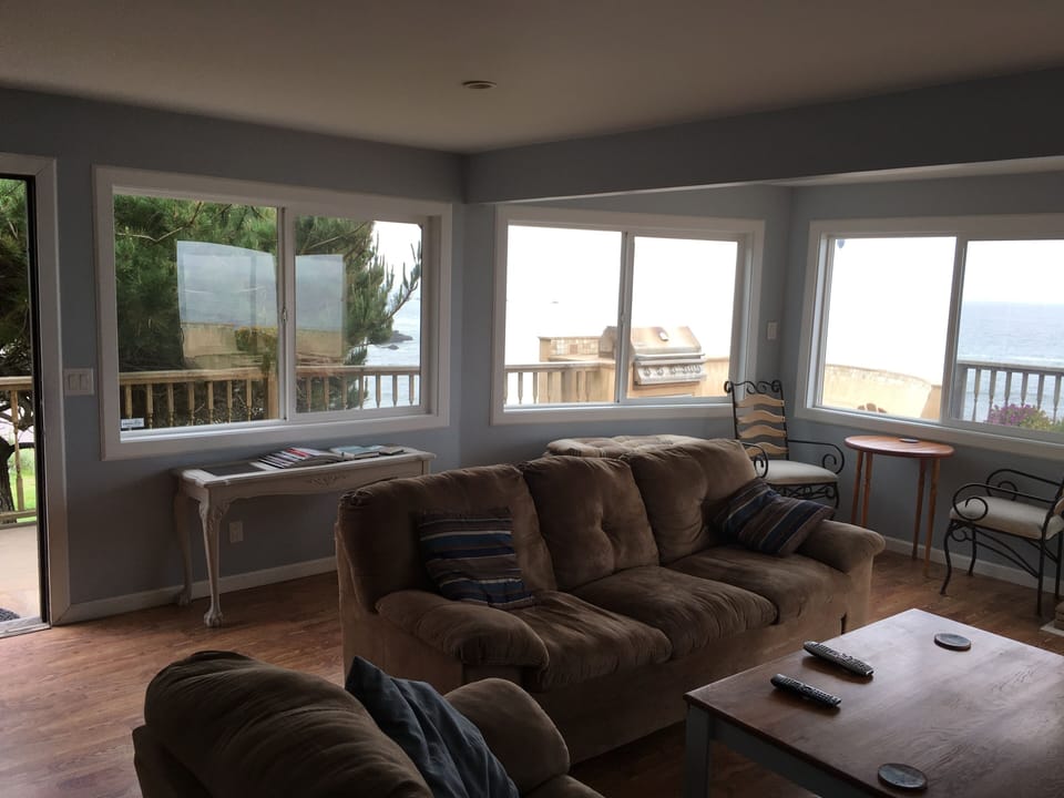 Ocean views from wall of windows in living rooms
