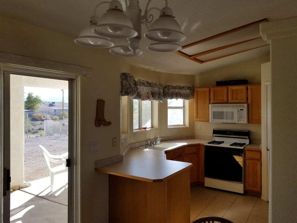 Sliding door to the back yard located off the kitchen