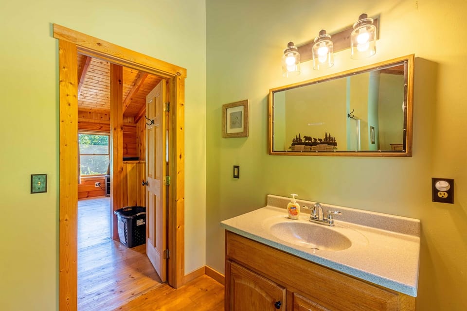 The upstairs loft bathroom has a single sink.
