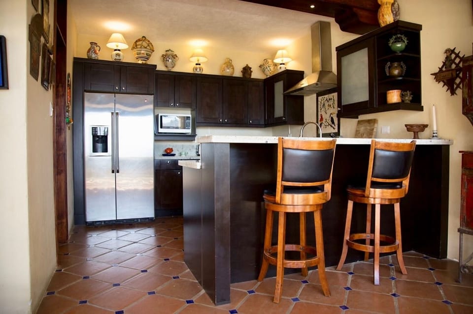 View of kitchen and bar stool counter