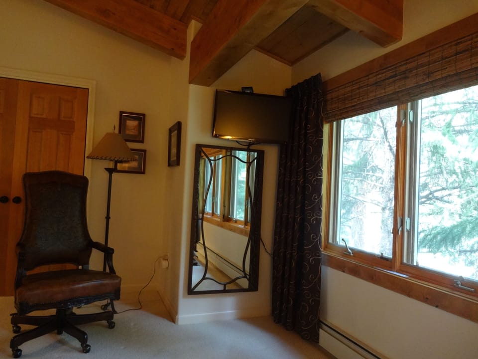 Creekside bedroom; all 3 upstairs rooms have TVs