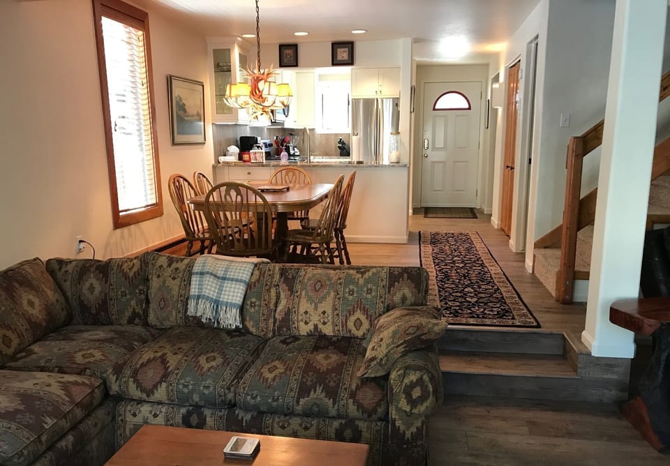 View of dining room and kitchen from the sunken den.