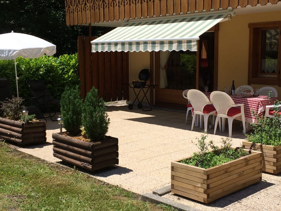 Patio with seating for 6, BBQ and sun loungers