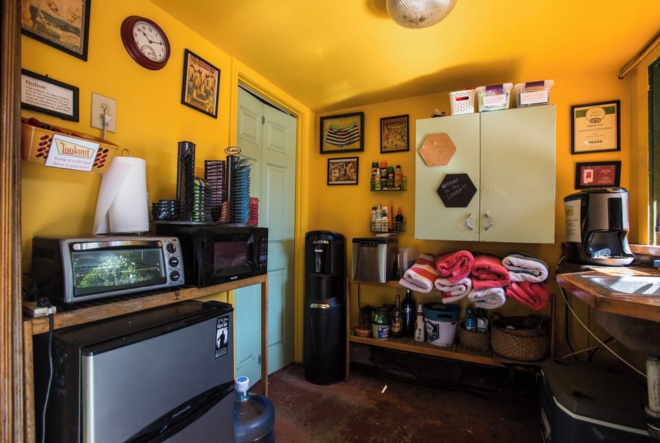 Kitchenette cabana w/ mid size fridge, toaster oven, microwave, cooler and sink.
