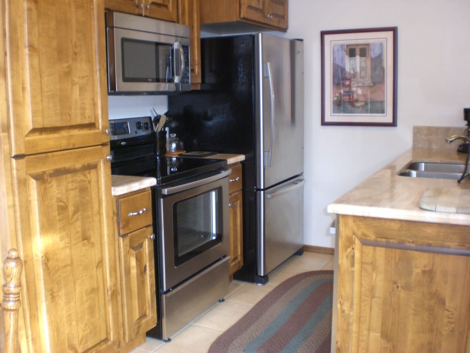 Beautiful custom cabinets and stainless steel appliances.  Marble counter tops

