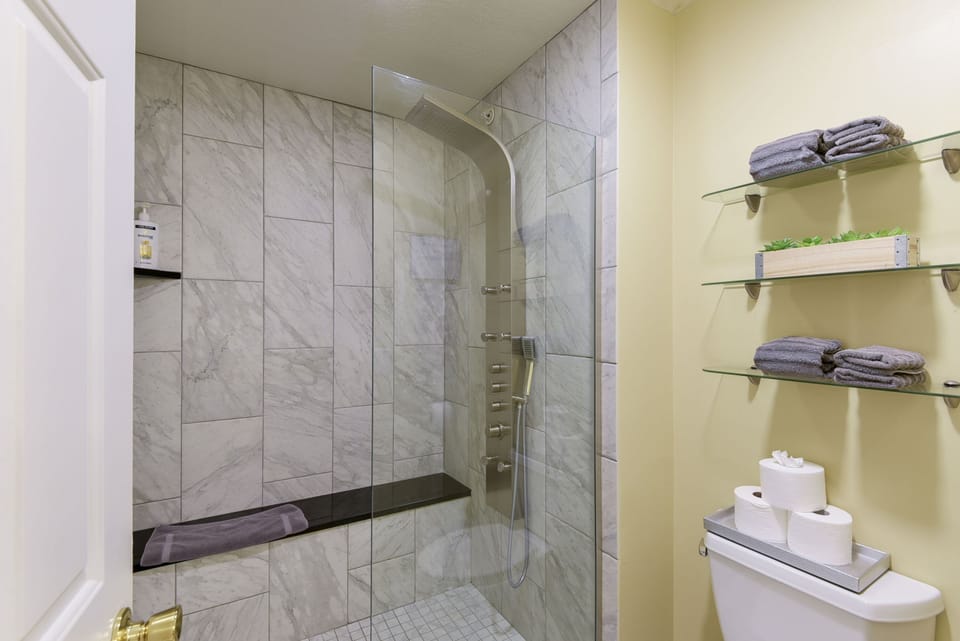 A nice massaging shower! With a bench seat!