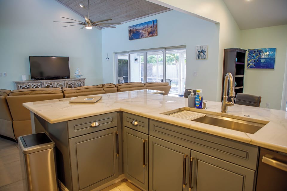 Kitchen island with extra sitting area on the other side.