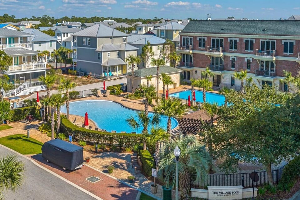 The resort pools (one is seasonally heated), hot tub and grilling complex for guests residing at The Village