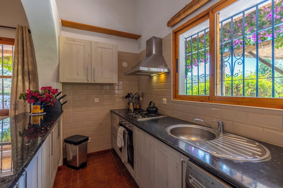 Kitchen with Views of the Garden and Pool