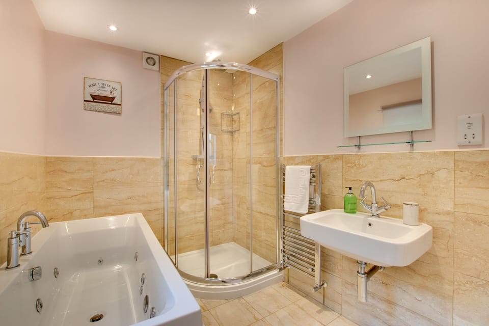 En-suite athroom with spa bath and separate walk-in shower