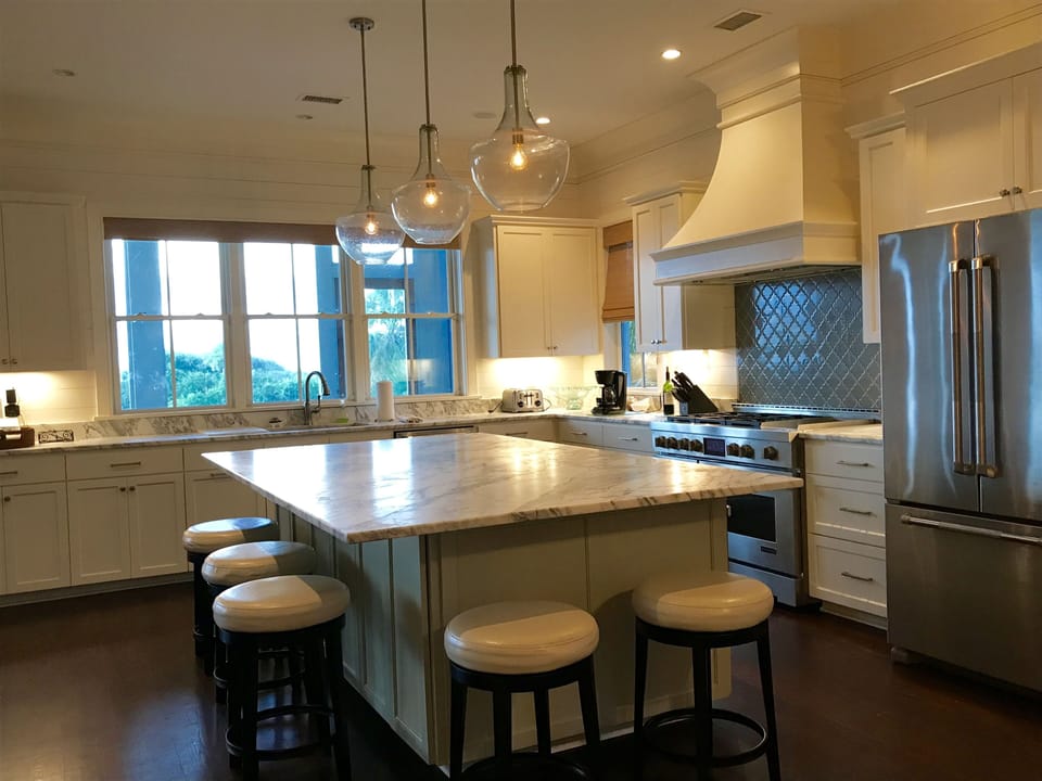 Seating for 5 at the marble island, high end appliances, ocean views