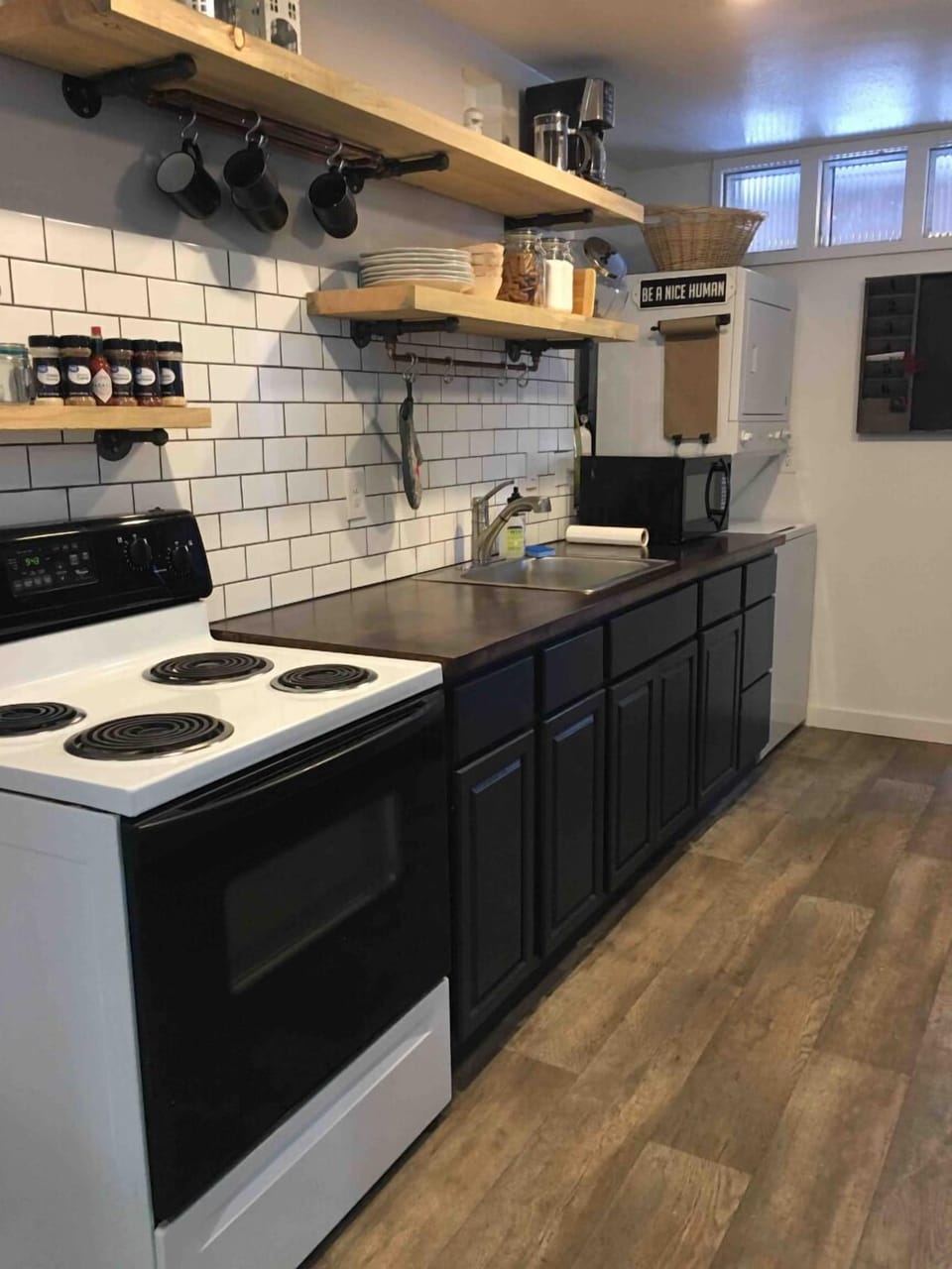 Kitchen- lrg refrig, oven, sink, micro, washer/dryer, pots, pans, spice, etc
