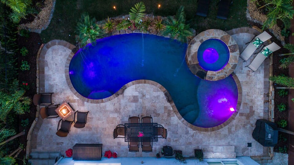 Gorgeous resort-style pool with spitters, tanning ledge, bubbler and large spa