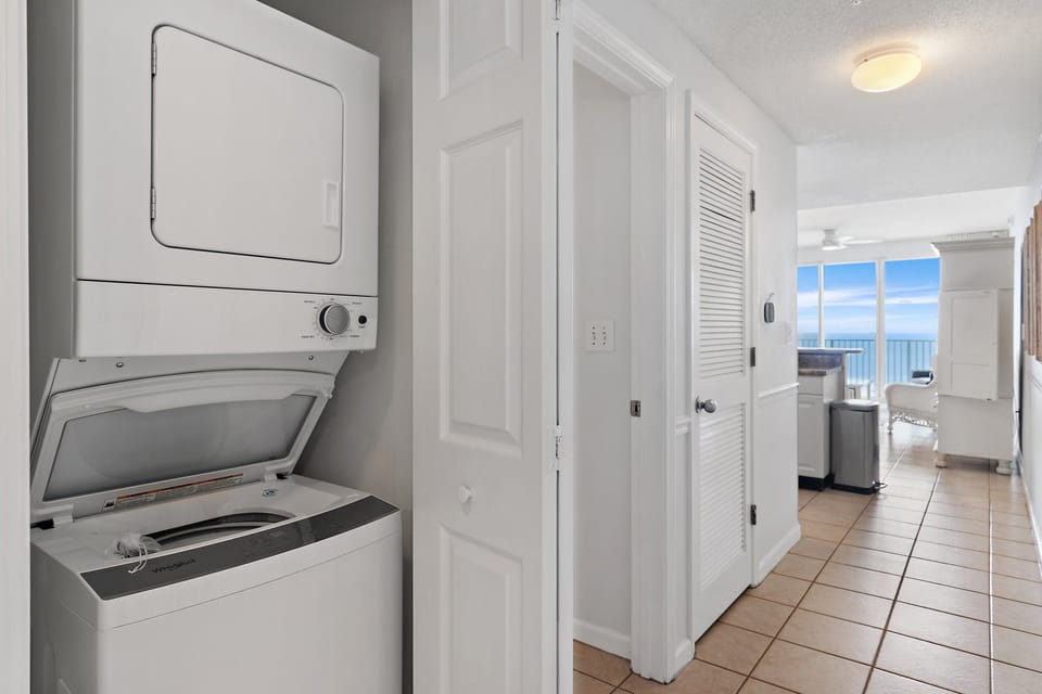 A stacked washer and dryer keeps packing light.