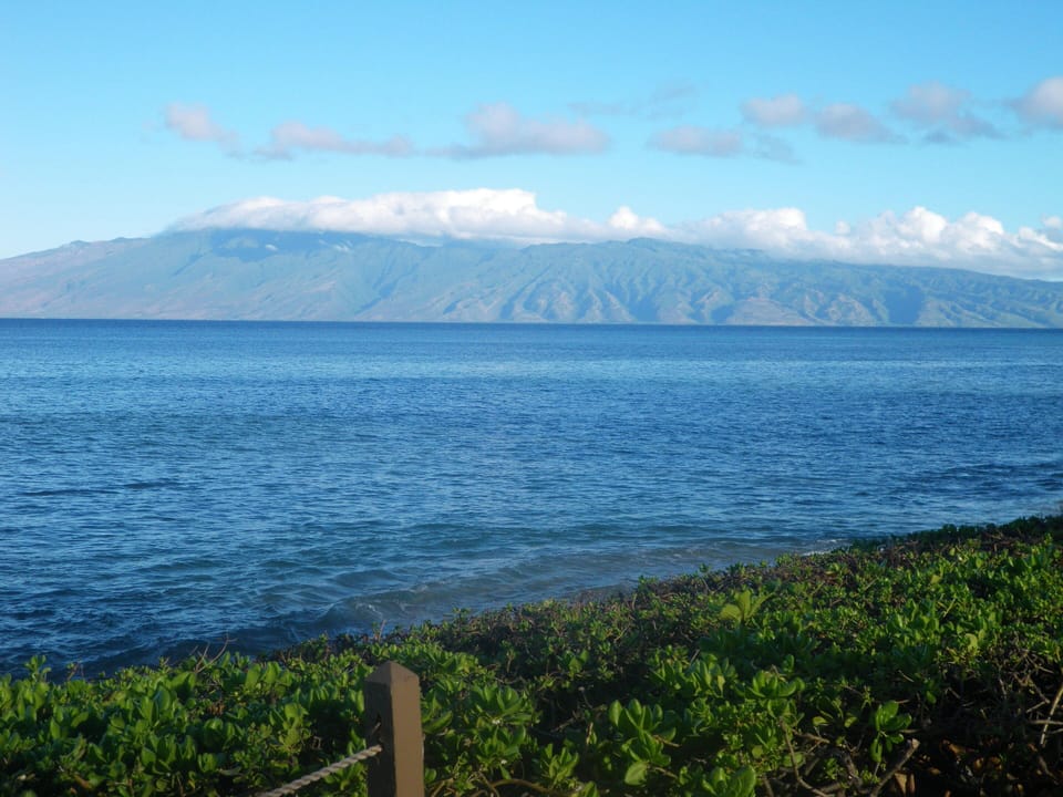 You can see the clear turquoise ocean & the island of Lanai from our place.  