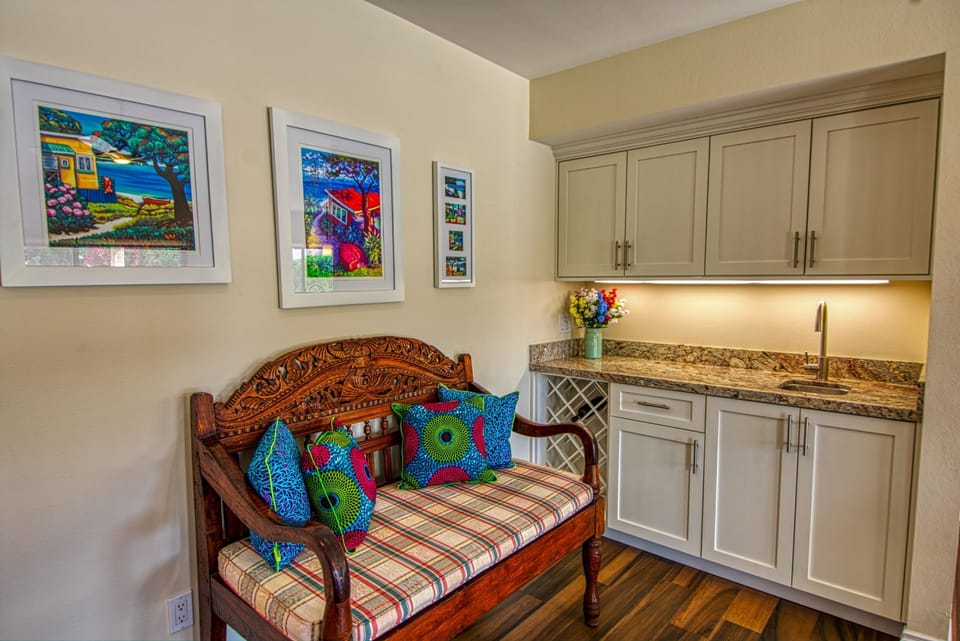 The wet bar is a perfect place to mix a cocktail or pour a glass of wine.