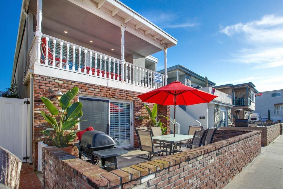 Our coveted 35th Street downstairs patio provides ocean views from the front patio, four houses back from beachfront and boardwalk; includes outdoor dining, propane bbq grill, market umbrella.
                