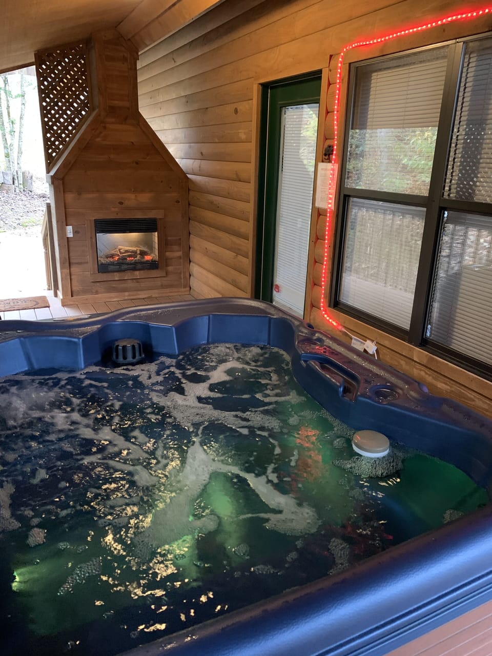 C’mon in the bubbling, light changing hot tub to soak away the day!