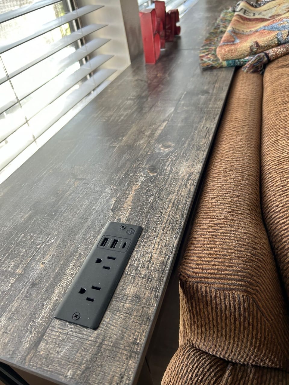 USB charger for couch lounging (behind couch on table)