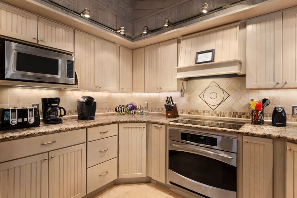 Kitchen has all you'll need plus stainless steel appliances and granite counters