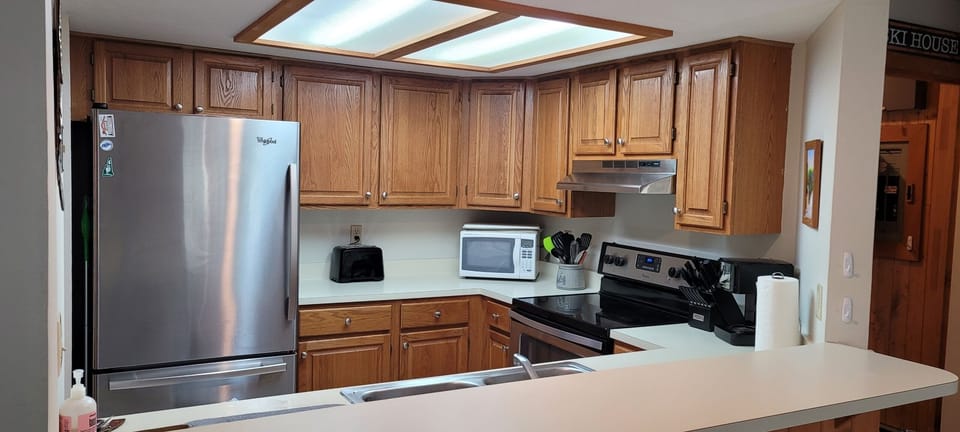Kitchen with breakfast bar. 