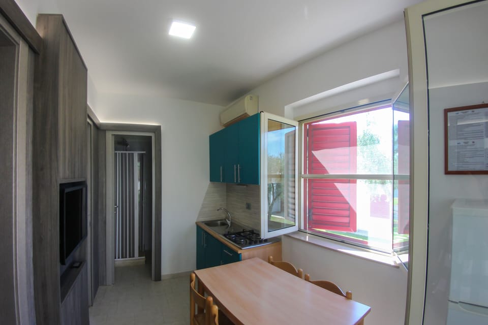 Economy Apartment, 2 Bedrooms, Garden View, Ground Floor | Living area | 26-inch flat-screen TV with cable channels, TV