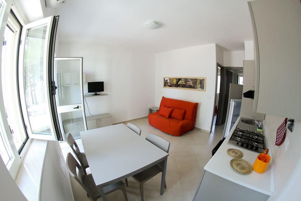 Standard Apartment, 1 Bedroom, Courtyard View, Ground Floor | Living area | 26-inch flat-screen TV with cable channels, TV