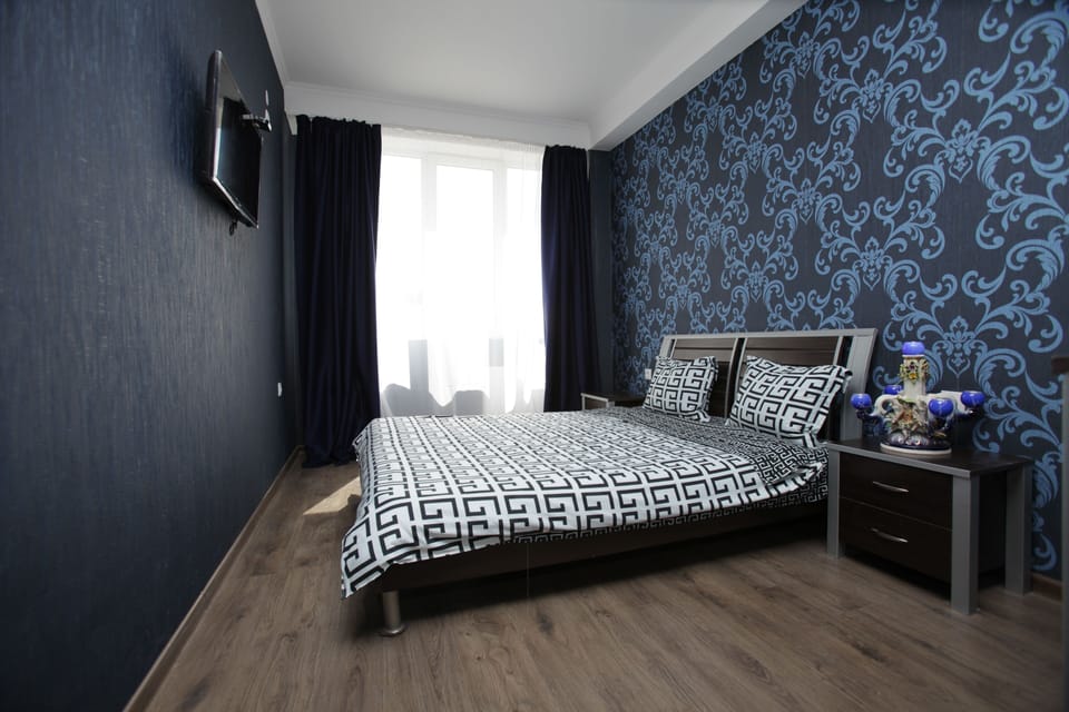 Deluxe Apartment, 2 Bedrooms, Kitchen, City View | Premium bedding, minibar, in-room safe, individually decorated