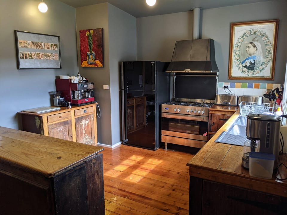 The Kitchen has crockery/cutlery/cooking implements/ espresso machine