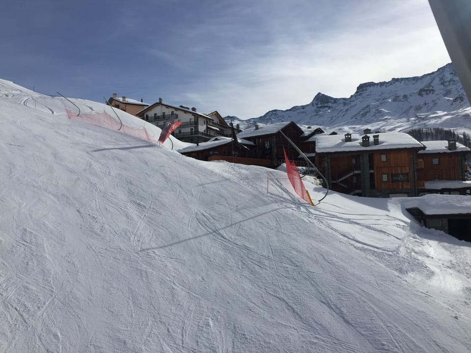 The view from the slope of the building (it is the white one).