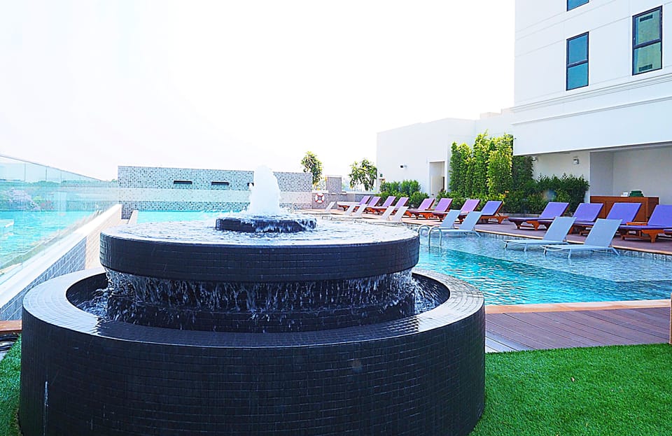 Outdoor pool, open 8:00 AM to 8:00 PM, pool umbrellas, sun loungers