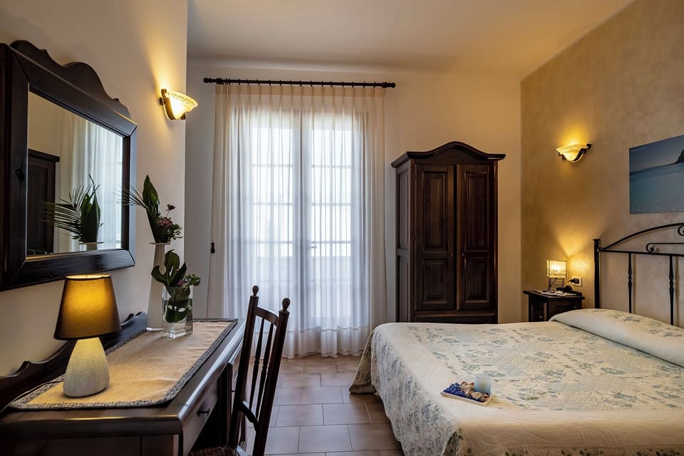 Family Superior con Balcone | Minibar, in-room safe, blackout drapes, soundproofing