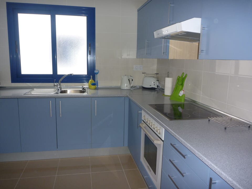 Kitchen area with a separate utility room.