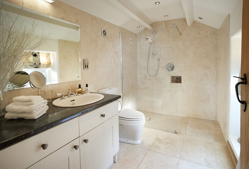 First floor: Limestone wet room with walk-in rain shower