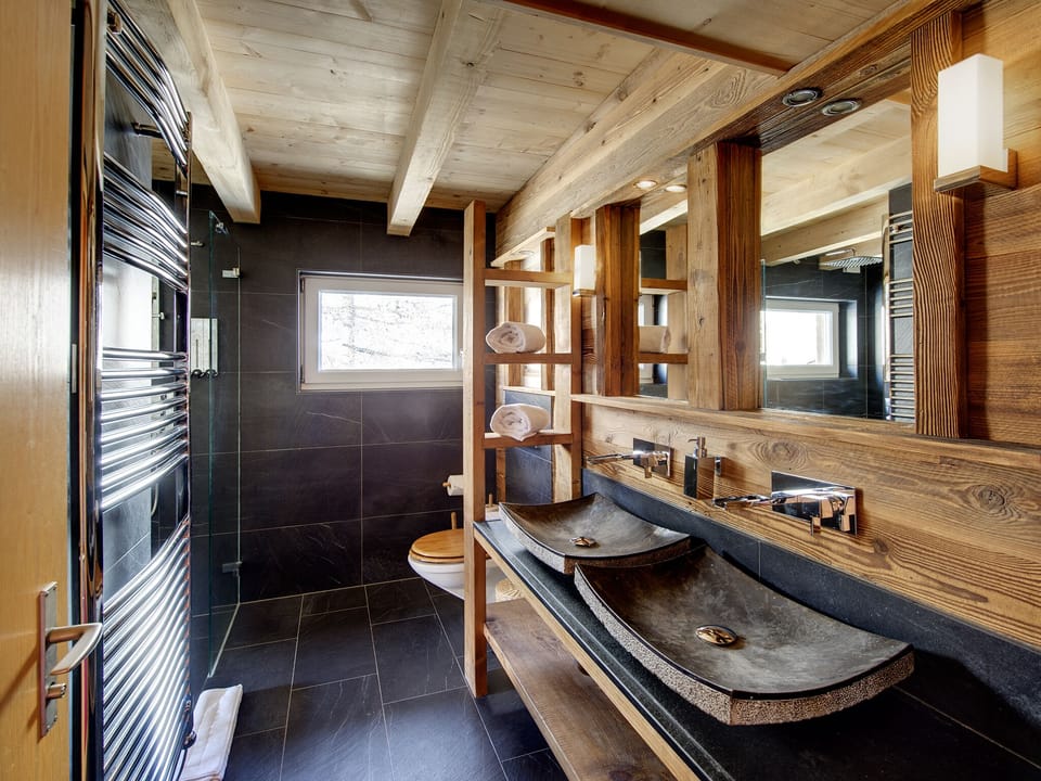 Luxury spacious bathroom with walk in rain shower and adjoining whirlpool bath