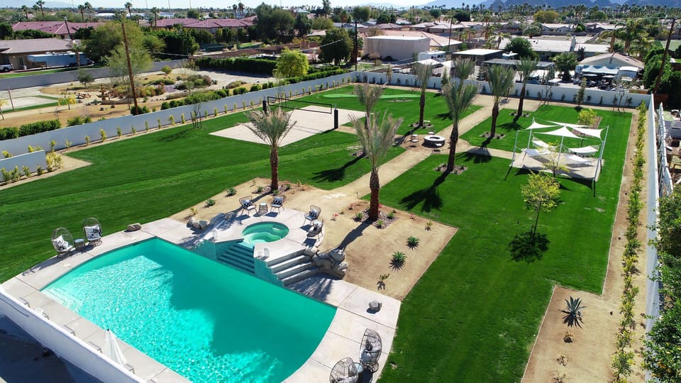Expansive 1.0 acre yard with resort-style amenities: large pool/spa, sand volleyball, putting green, fire pit, bocce ball, hammock garden, corn hole. Amazing mountain views!