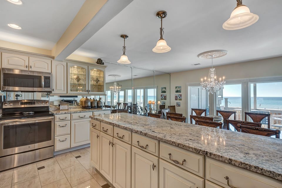 Another view of the kitchen showing a wall of mirrors behind it.