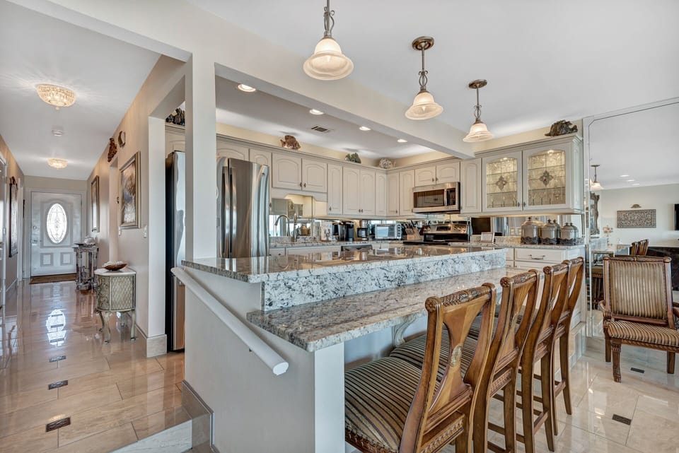 One step is present at both ends of the kitchen (showing handrail to hold onto).