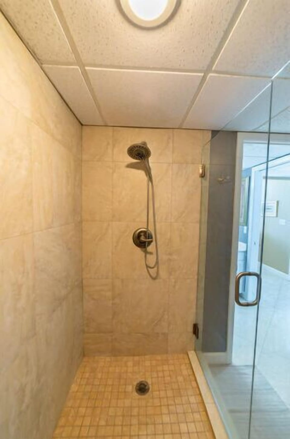 Enjoy rinsing off in the master bathroom tiled walk-in shower
