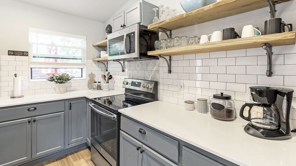 Fully-stocked kitchen with floating shelves