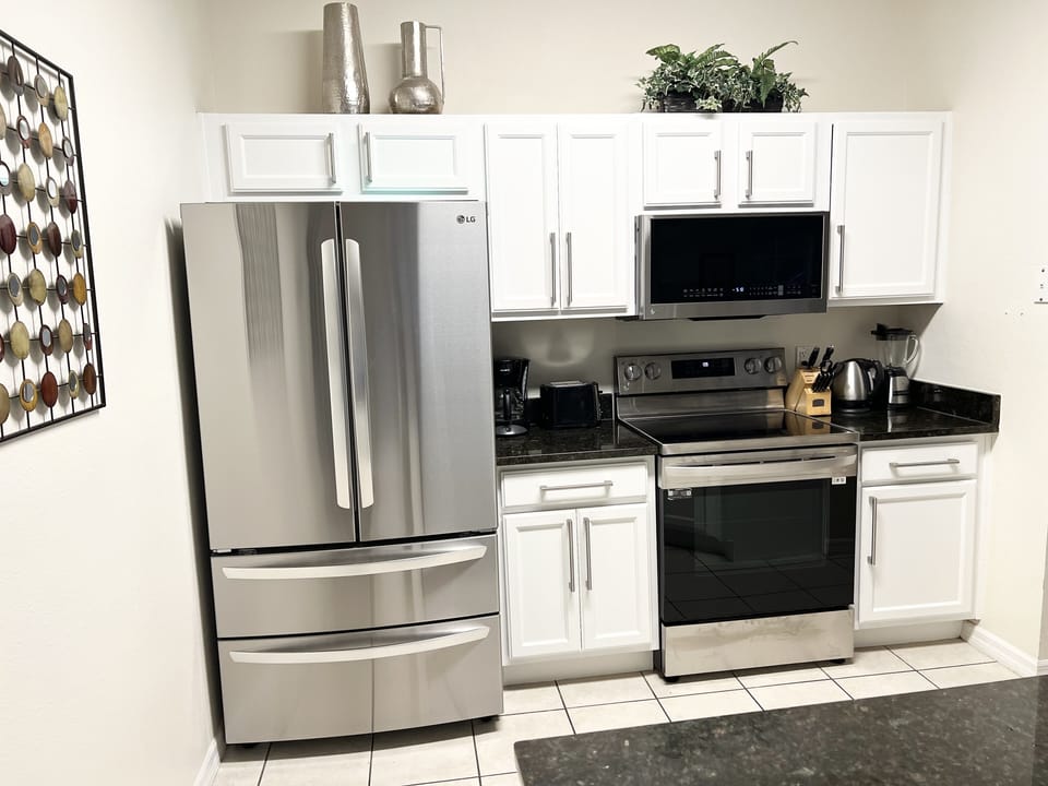 Fridge: filtered water tap inside + ice maker.  Oven: convection & conventional.