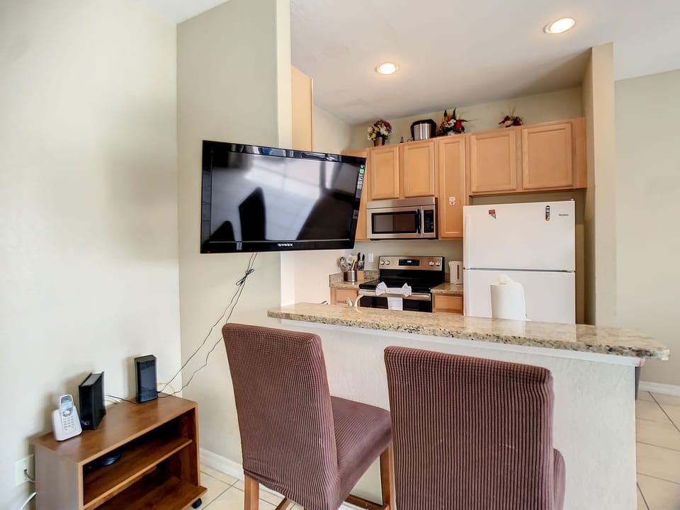 Fully Equipped Kitchen with bar chairs