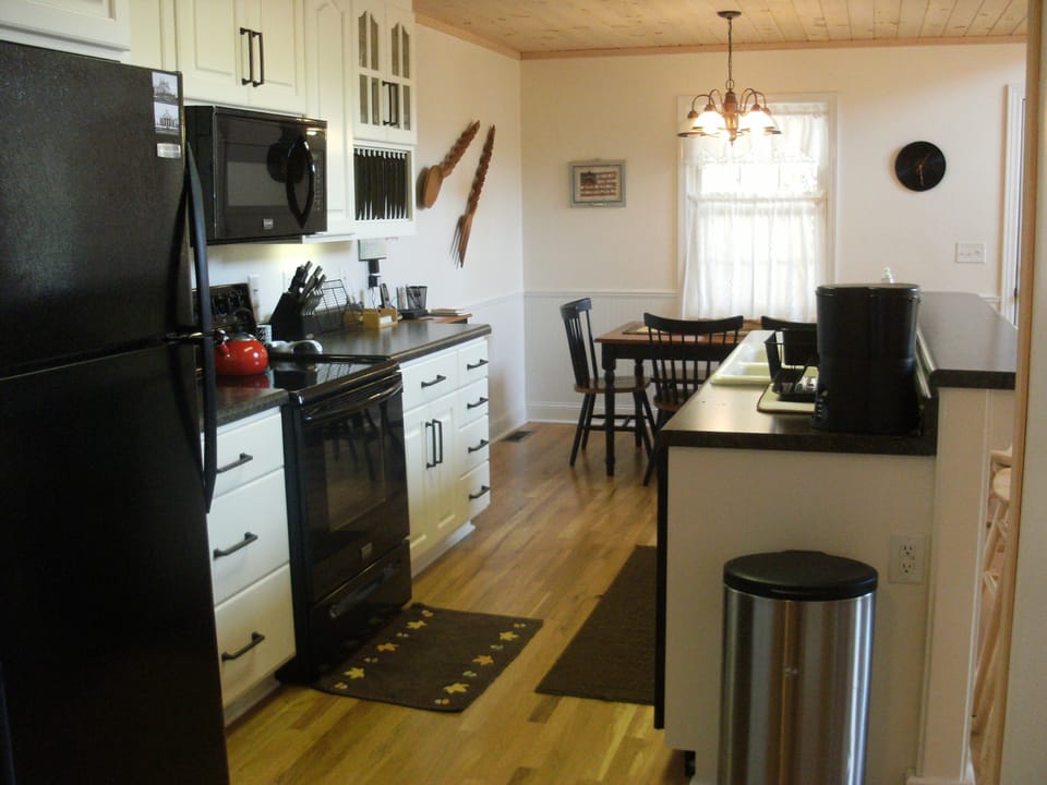 Kitchen - Custom-made cabinets. Newer appliances (convection oven, dishwasher).