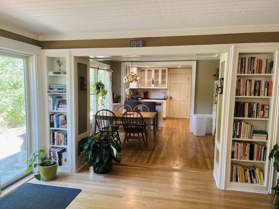 Open layout kitchen, dining + living room